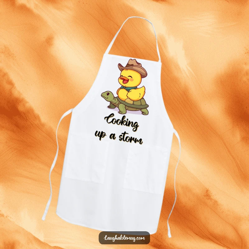 Funny apron featuring a duck cowboy humorously riding a turtle, perfect for kitchen fun.
