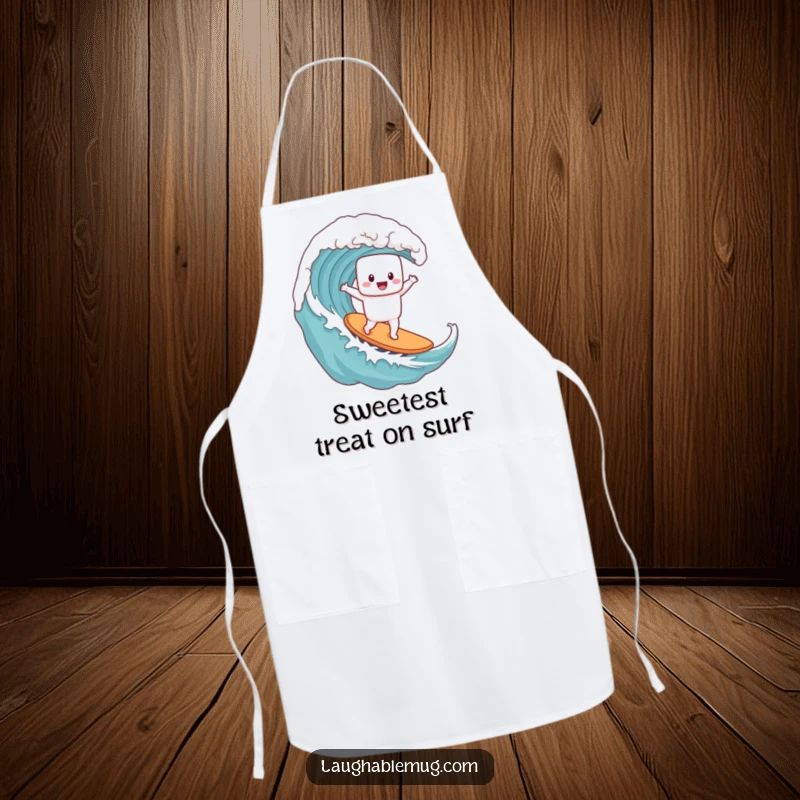 Funny apron featuring a cheerful marshmallow character surfing a coffee wave, perfect for kitchen fun and protecting clothes during cooking.