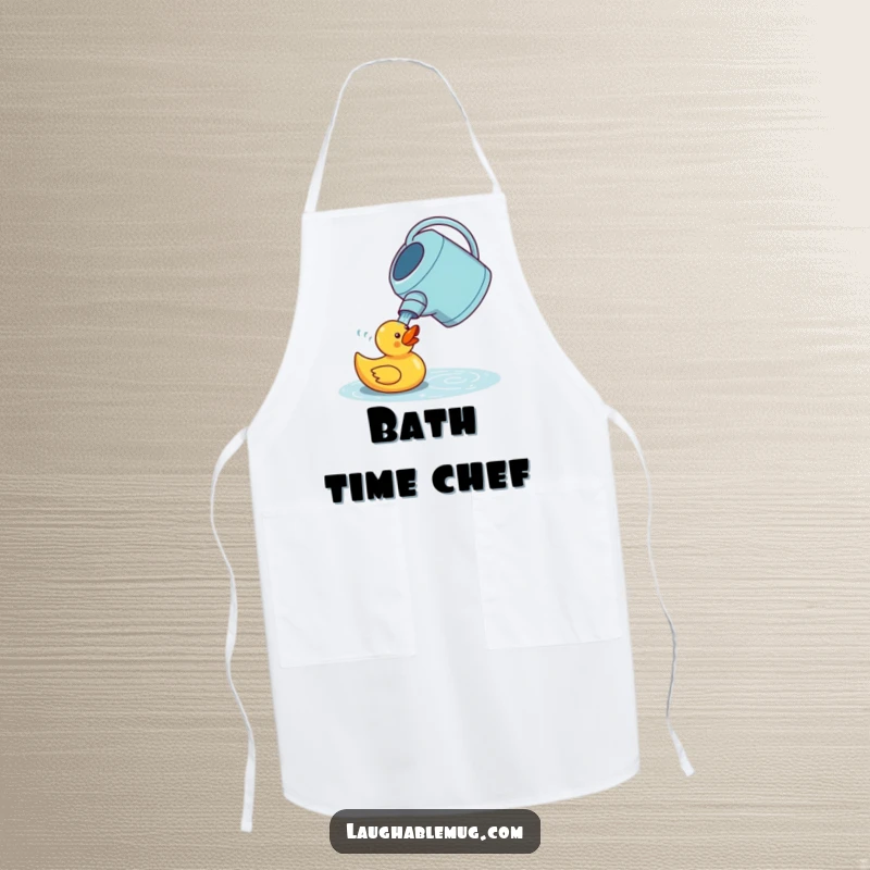 Funny apron depicting a confused watering can trying to water a rubber duck, designed for kitchen or garden use and adding whimsical humor.