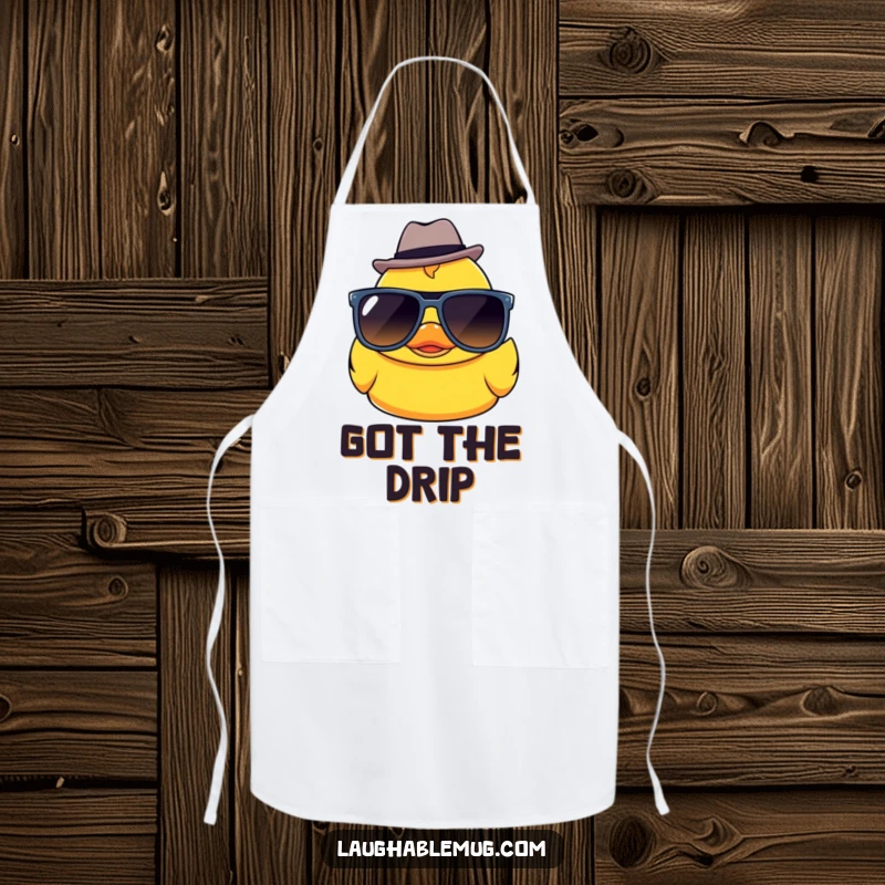 Funny Kawaii rubber ducky character in sunglasses and a fedora, wearing a chef’s apron for kitchen fun.