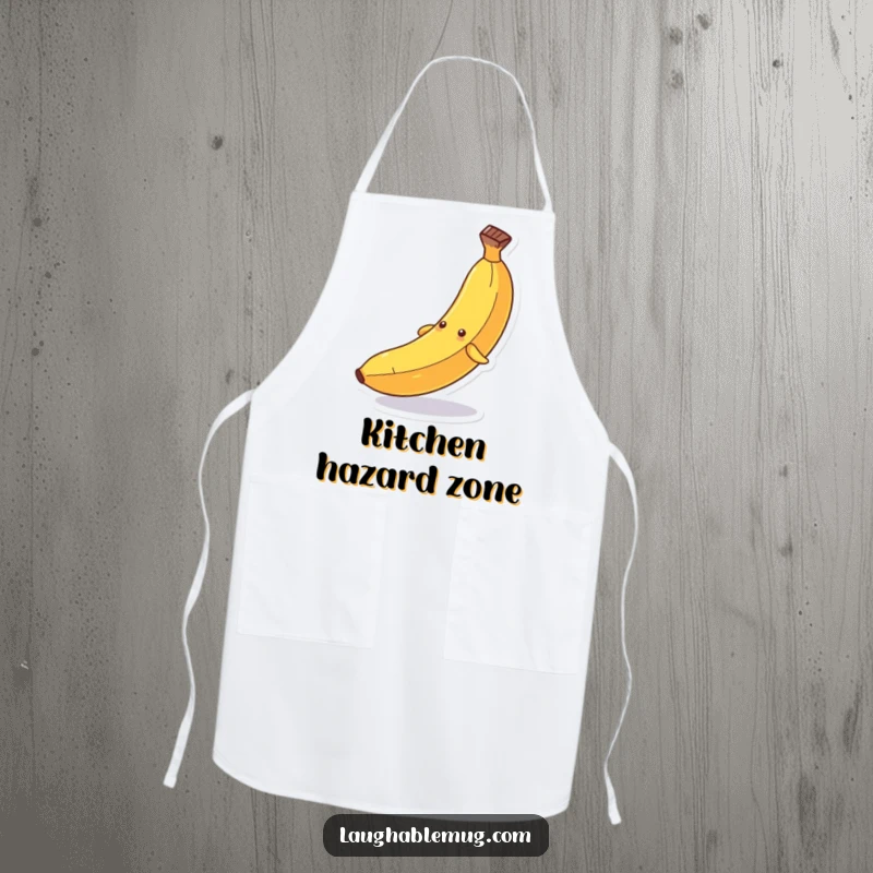 Funny apron: A personified banana comically slipping dramatically on its peel, designed for chefs who cook with humor.