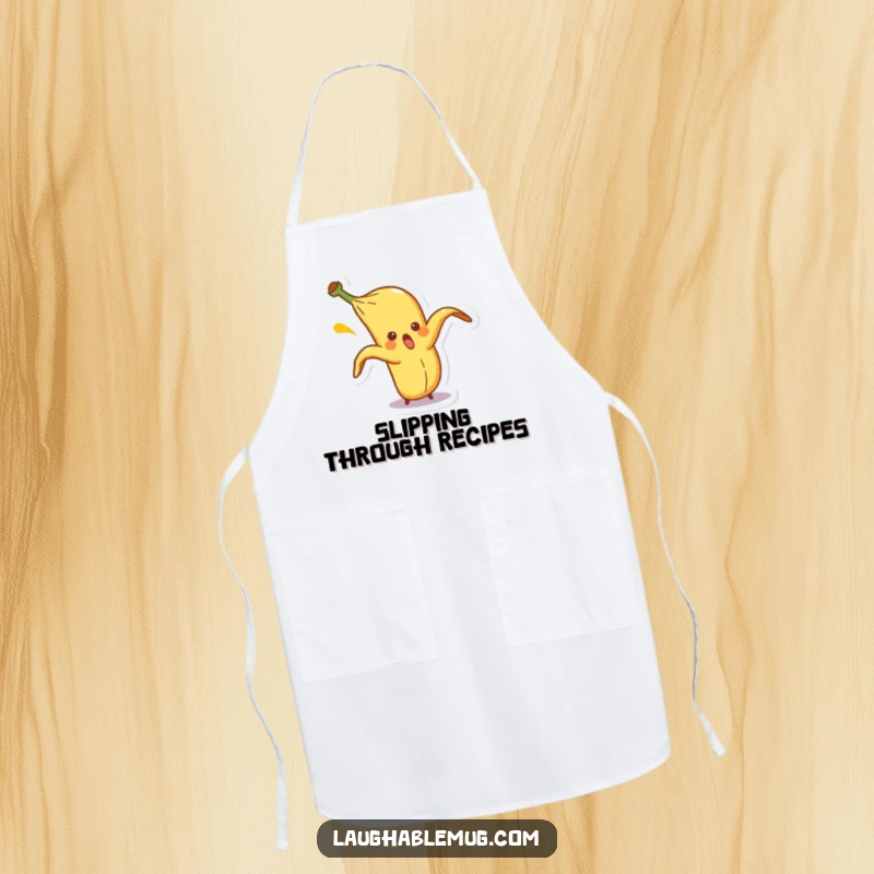 Funny apron featuring a surprised banana peel character comically slipping on itself, perfect for humorous cooking and kitchen adventures.