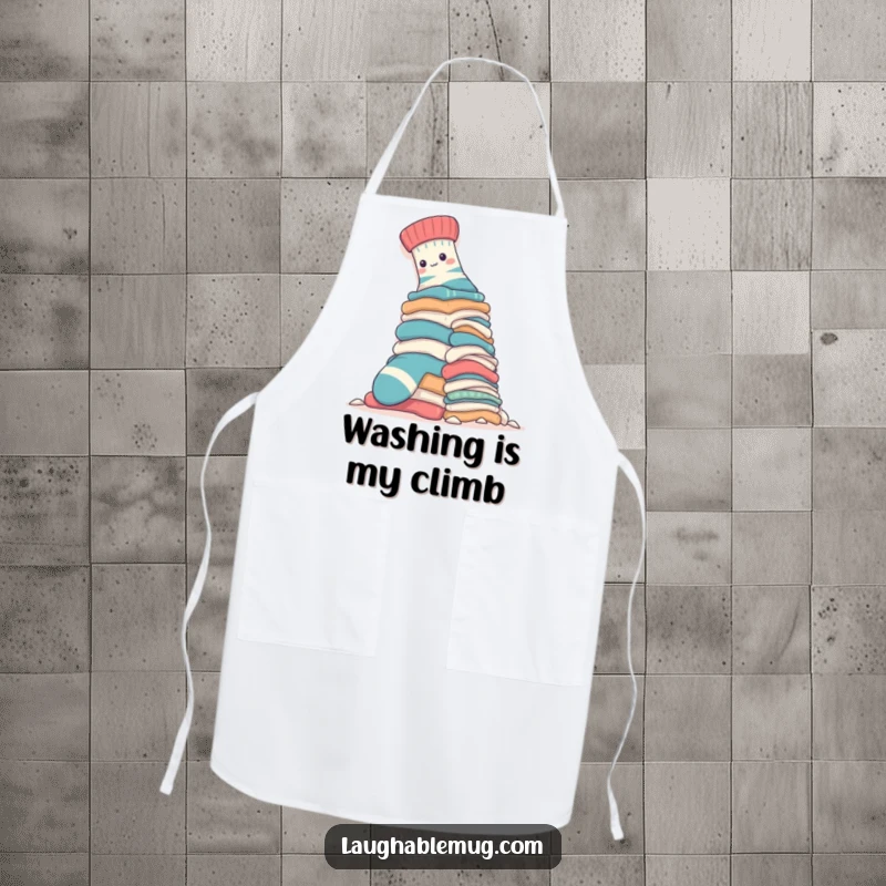 Funny Apron: A brave sock is shown mountaineering a huge pile of laundry, making kitchen tasks humorous for the wearer.