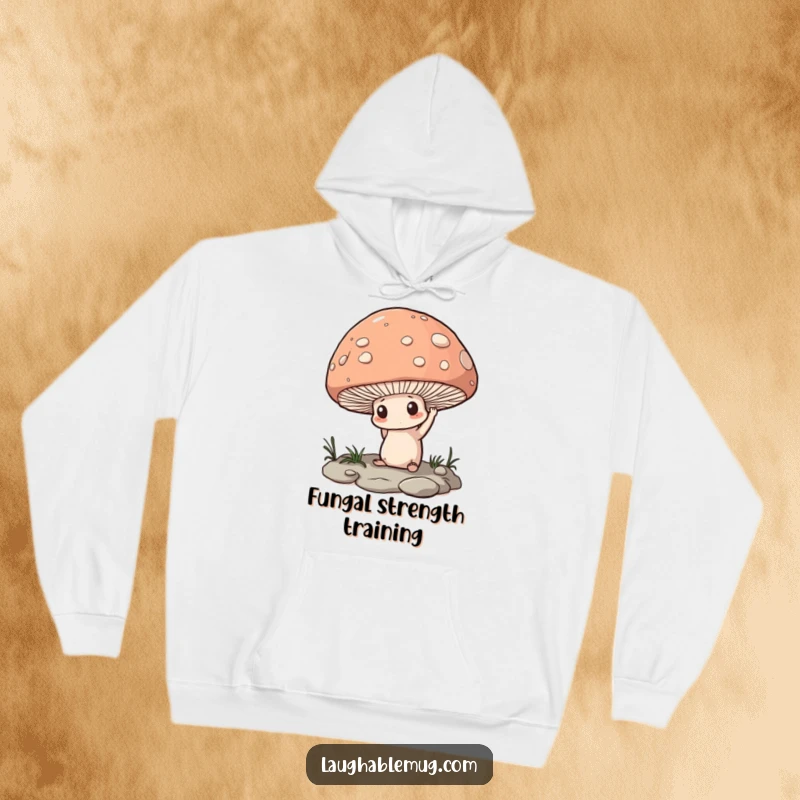 Funny Hoodie: A determined mushroom attempting to lift a massive pebble, illustrating effort and humor.