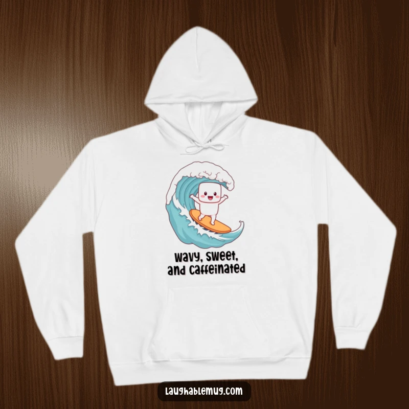 Funny hoodie depicting a delighted marshmallow character expertly surfing a giant coffee wave, capturing a moment of extreme fun.