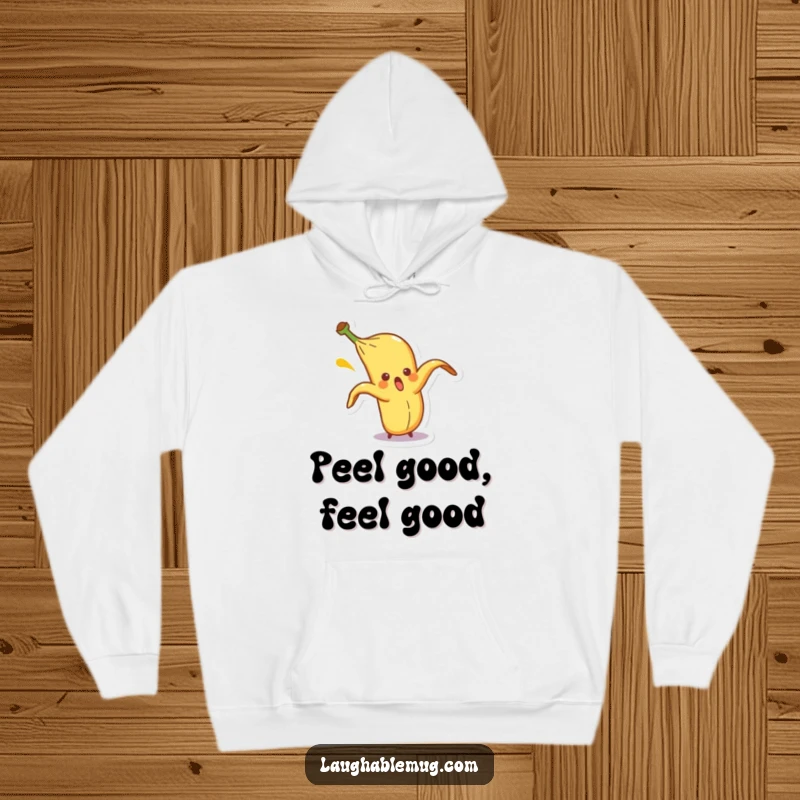 Funny hoodie with a surprised banana peel character comically slipping on itself, offering cozy comfort and playful, slapstick humor.