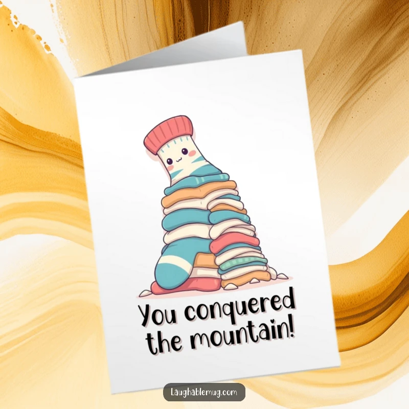 Funny free printable congratulations card: A sock heroically climbs a huge laundry pile, celebrating a big win. Downloadable art.