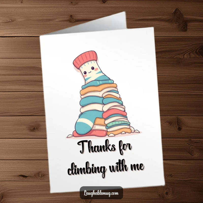 Funny free printable thank you card: A sock triumphantly scales a mountain of clothes, expressing gratitude. Unique DIY gift.