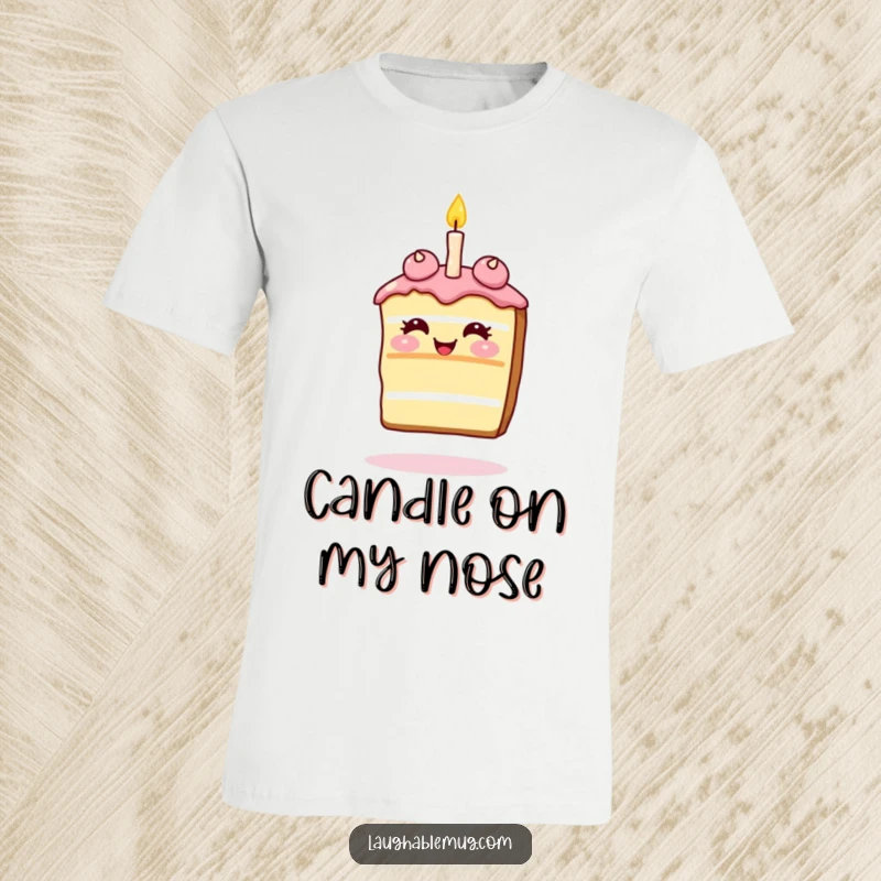 Funny T-Shirt: Giggling slice of cake balancing a single candle on its nose, a fun and festive design.