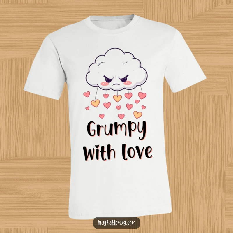 Funny t-shirt depicting a grumpy cloud raining happy little hearts, a symbol of mixed emotions.