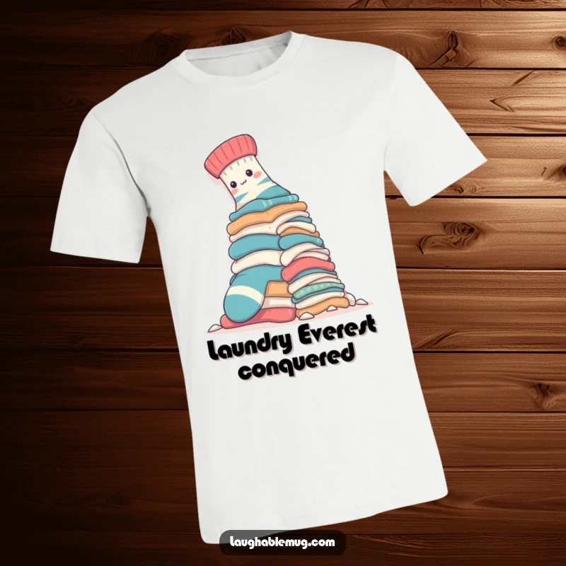 Funny T-Shirt: A brave sock is depicted mid-climb up a huge, daunting laundry pile, showing great effort and a determined spirit.