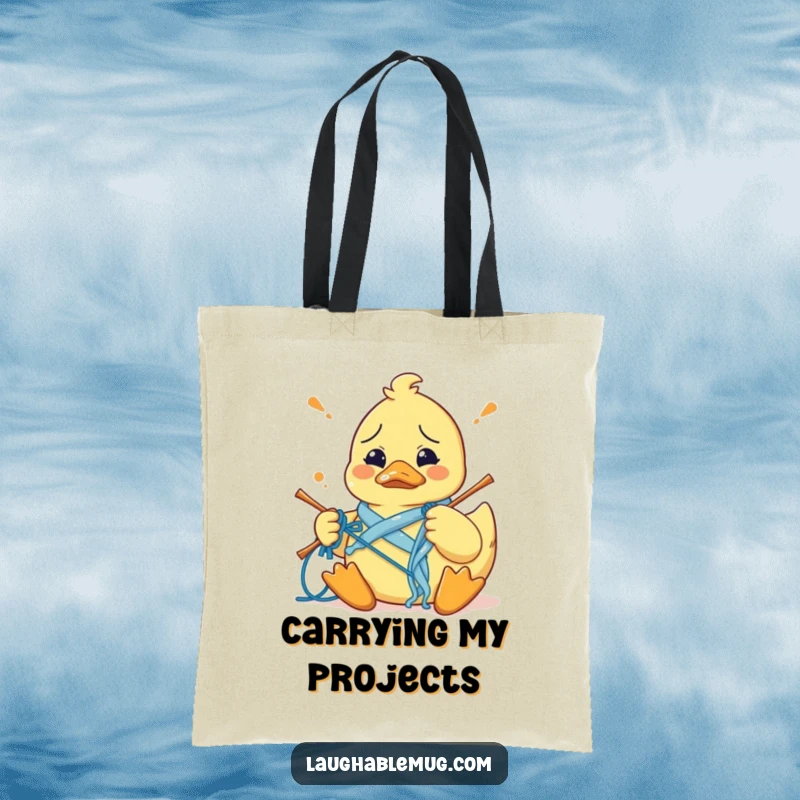 Funny tote bag with a confused rubber duck hilariously tangled in knitting yarn, perfect for carrying craft supplies and humor.